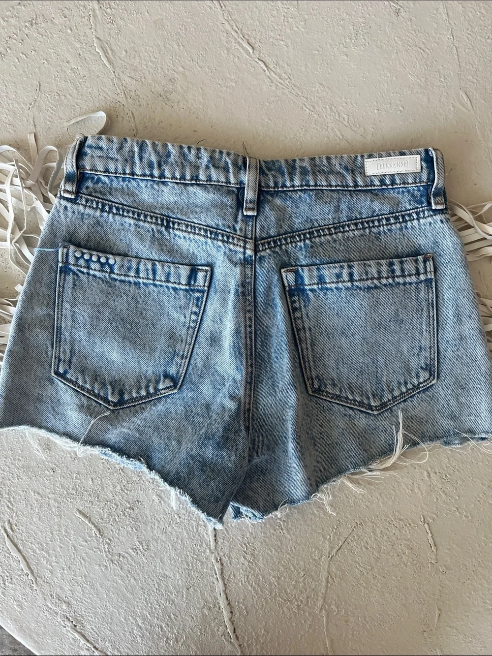 Blank NYC Light Wash Denim Fringe Side High-Rise Shorts